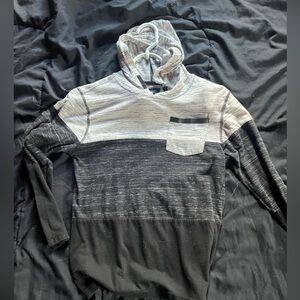 A long sleeve hoodie that's is black and white